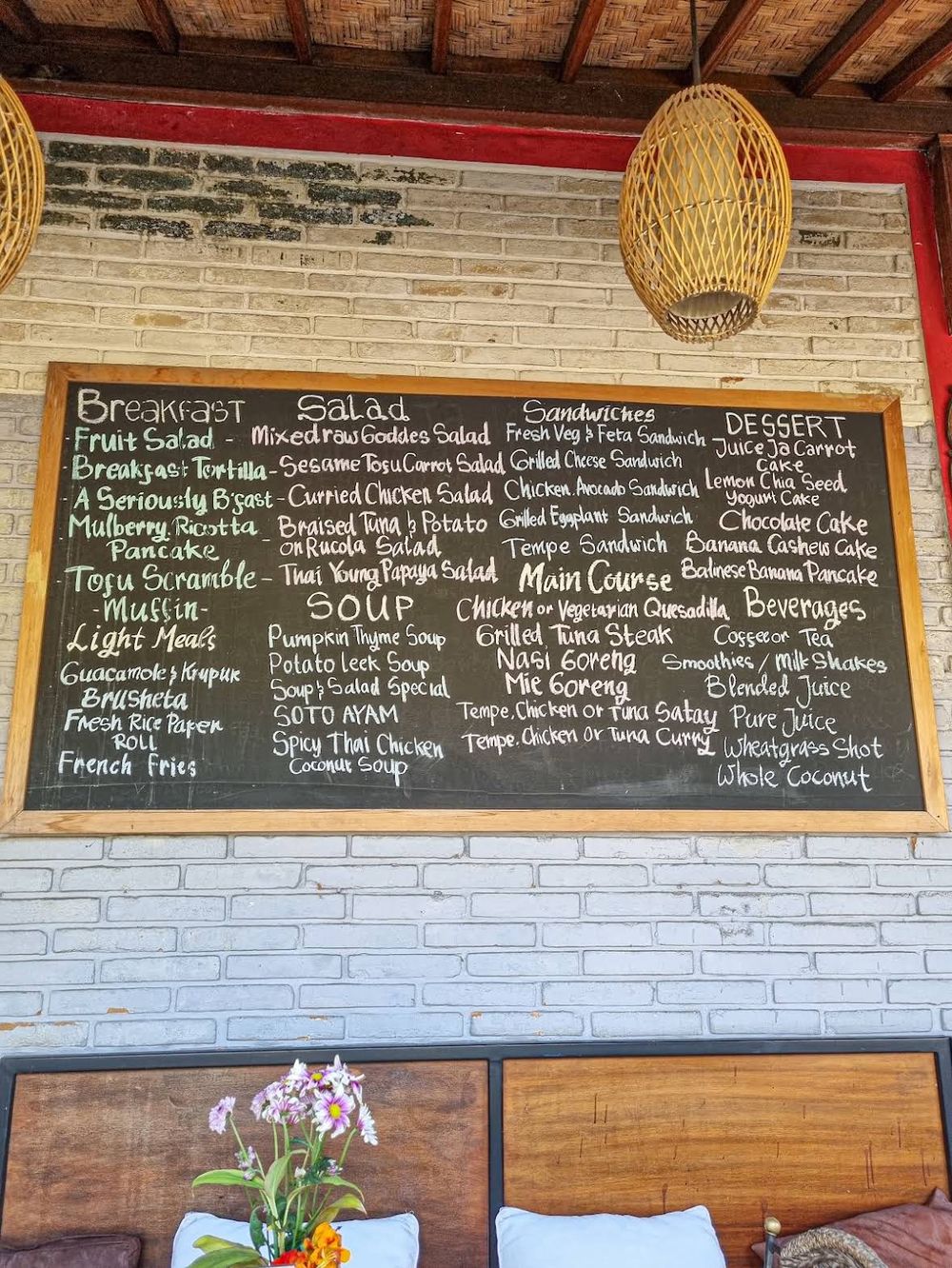 Hand-written chalkboard menu on the café's terrace